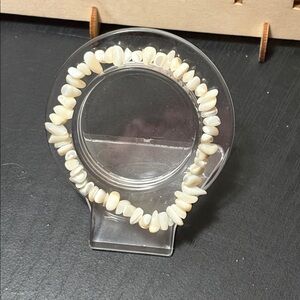 handcrafted bracelet features iridescent white shell chips beaded bracelet